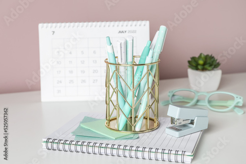 Golden pen cup with station...