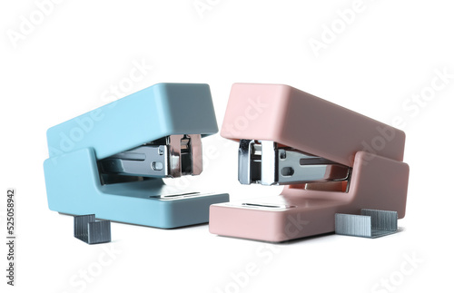 Blue and pink staplers with...