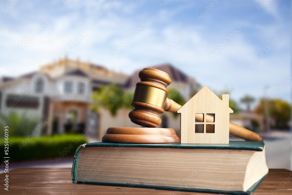 judge and house model on book on house background judge and house model on book on house background