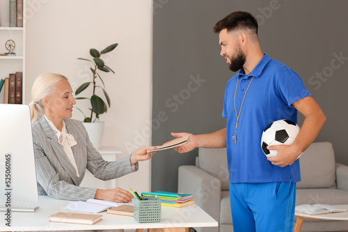 Teachers working in school ...