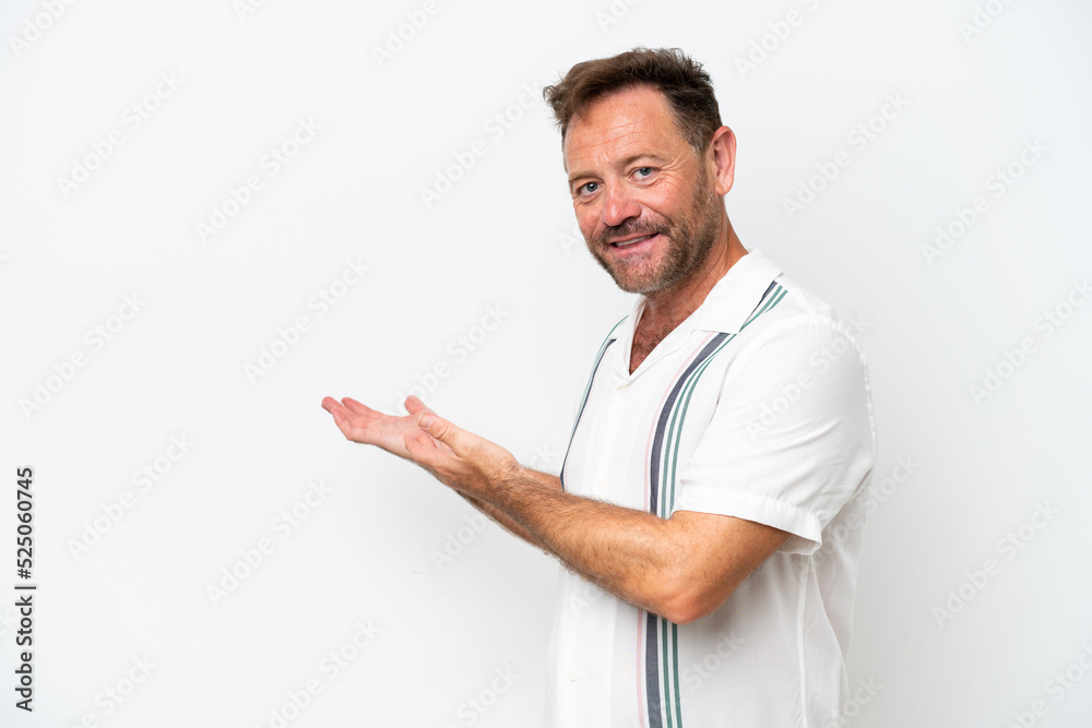 Middle age caucasian man isolated on white background extending hands to the side for inviting to come Middle age caucasian man isolated on white background extending hands to the side for inviting to come