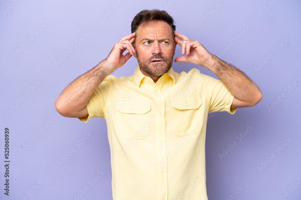 Middle age caucasian man isolated on purple background having doubts and thinking Middle age caucasian man isolated on purple background having doubts and thinking
