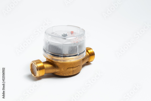 Close-up of water meter for hot water on white background.