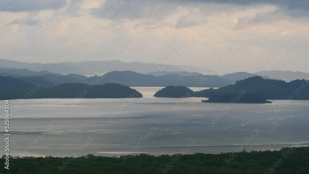 Time lapse of Samet Nangshe and fertile mangrove forest at sunset with Andaman sea in Phang Nga Bay, Thailand. Natural landscape background.