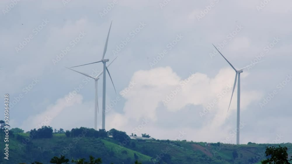 Panoramic view of wind turbines or wind farm with beautiful landscapes and blue sky to generate clean renewable green energy for sustainable development. Windmills for electric power production. Panoramic view of wind turbines or wind farm with beautiful landscapes and blue sky to generate clean renewable green energy for sustainable development. Windmills for electric power production.
