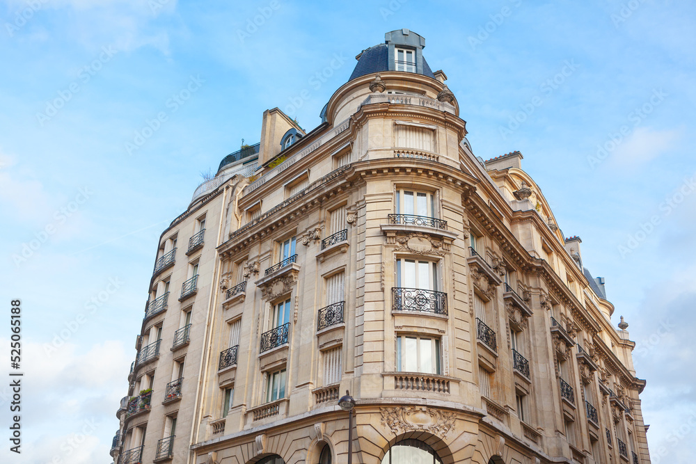 Residential building in Paris . Typical French Architecture . House with ornaments and balcony 