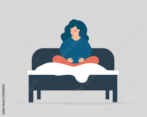 Pregnant wakes up, sits on her cozy bed and wearing pajamas. Woman expecting a baby gets up and touches her belly in the morning. Pregnancy breathing exercise, Positive mood and wellbeing concept.