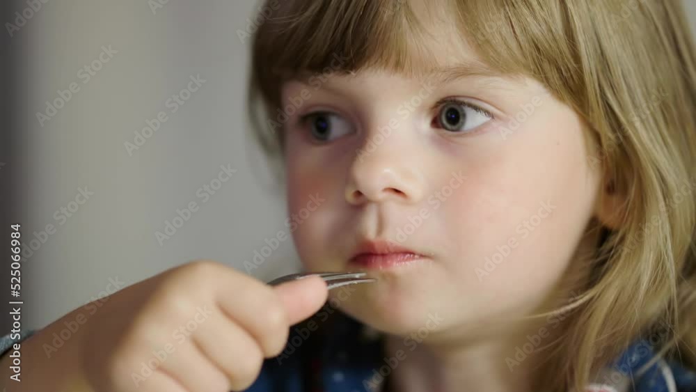 Portrait of a little girl eating pasta and smiling. Healthy food for children. Cute baby. High quality 4k footage Portrait of a little girl eating pasta and smiling. Healthy food for children. Cute baby. High quality 4k footage