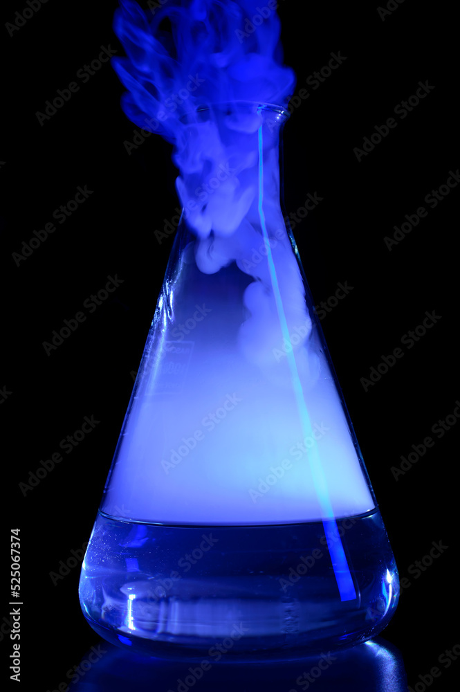 Strong chemical reaction with a lot smoke and vapors inside Erlenmeyer