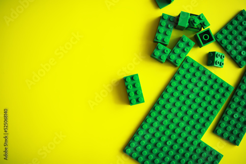 A scattering of constructor elements for children. Colored bricks from the puzzle.