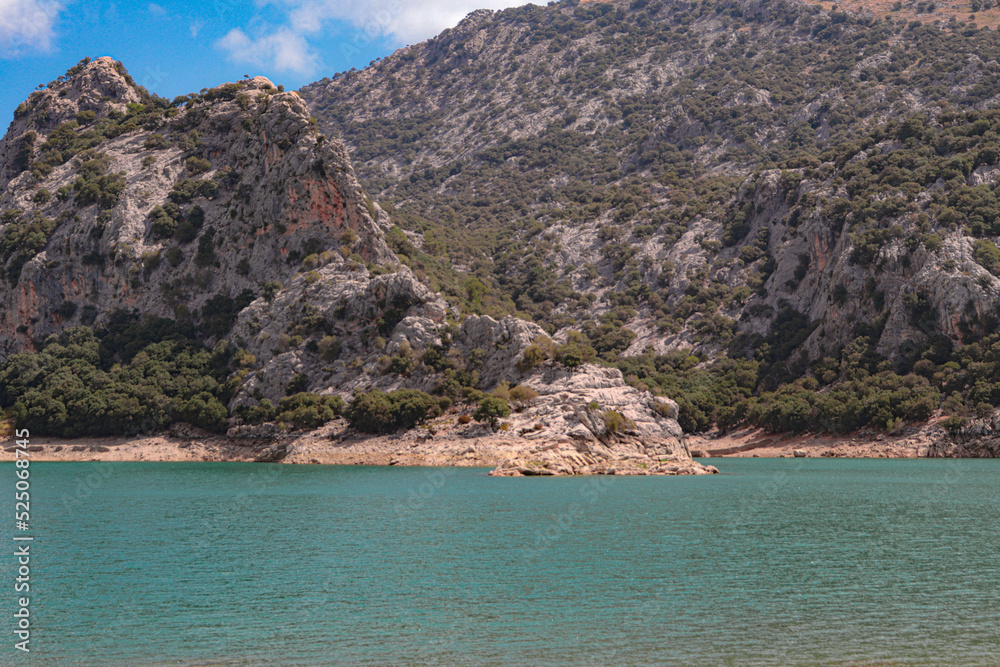 mountain landscape with clouds and lake in mallorca mountain landscape with clouds and lake in mallorca