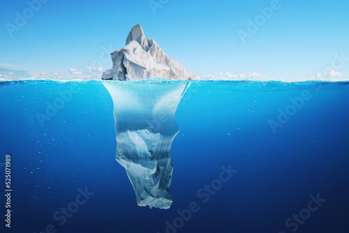 Amazing beautiful white iceberg with a view underwater in the ocean. Tip of the iceberg, concept. Hidden danger under water. Melting glaciers.