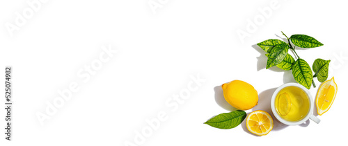 Lemon tea with ripe fruits and fresh leaves isolated on white background