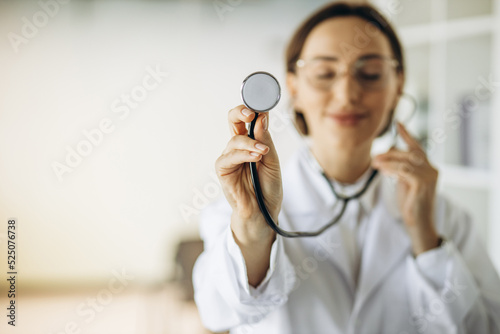 Woman doctor in lab coat with stethoscope