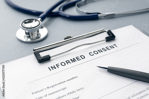 Informed Consent form and stethoscope on desk