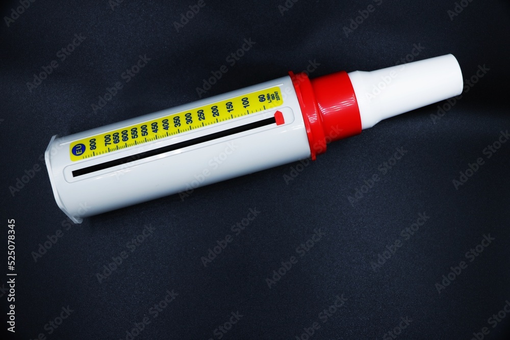 A peak flow meter with a disposable mouthpiece. Peak flow test used in