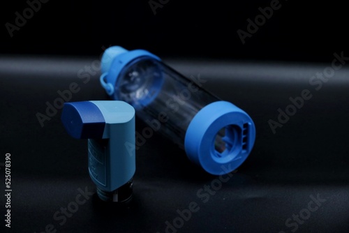 An inhaler with a spacer device. Spacer devices are used for effective medicine absorption in various respiratory conditions. photo