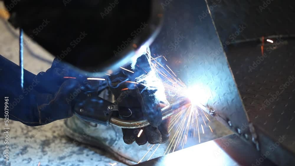 Hot welding arc used to connect metal sheets together to create customized product for customer. Hot welding arc used to connect metal sheets together to create customized product for customer.