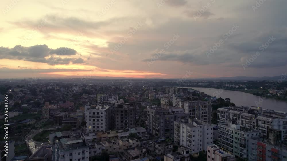 Aerial view of Indian city with river during sunset Aerial view of Indian city with river during sunset