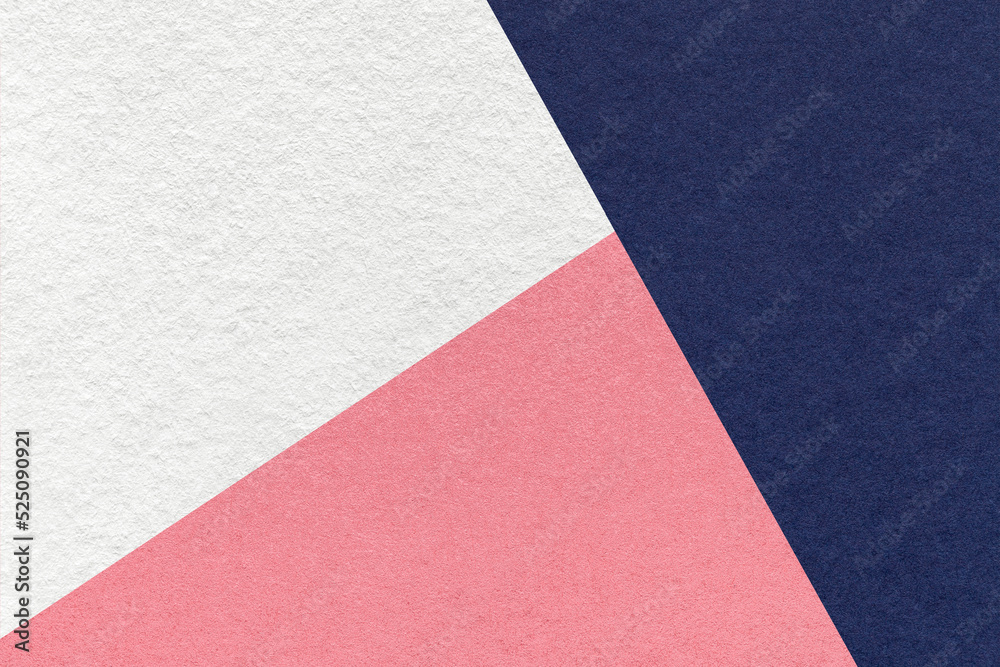 Texture of craft navy blue, white and pink shade color paper background, macro. Vintage abstract indigo cardboard