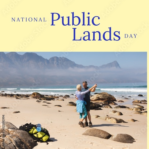 National public lands day text with couple dancing at beach