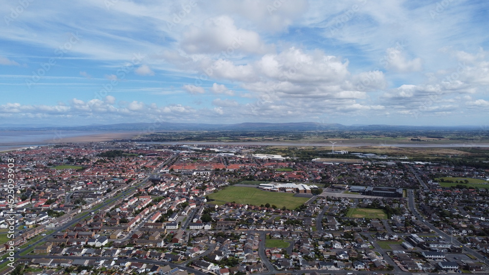 Aerial view of buildings and houses with a cloudy sky background. Taken in Fleetwood Lancashire England. 