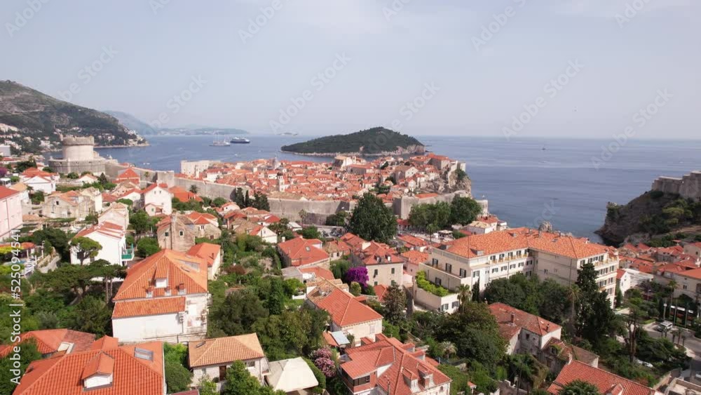 Aerial View of Dubrovnik, Croatia. Old Town City Walls and Buildings Under Residential Neighborhood, Drone Shot Aerial View of Dubrovnik, Croatia. Old Town City Walls and Buildings Under Residential Neighborhood, Drone Shot