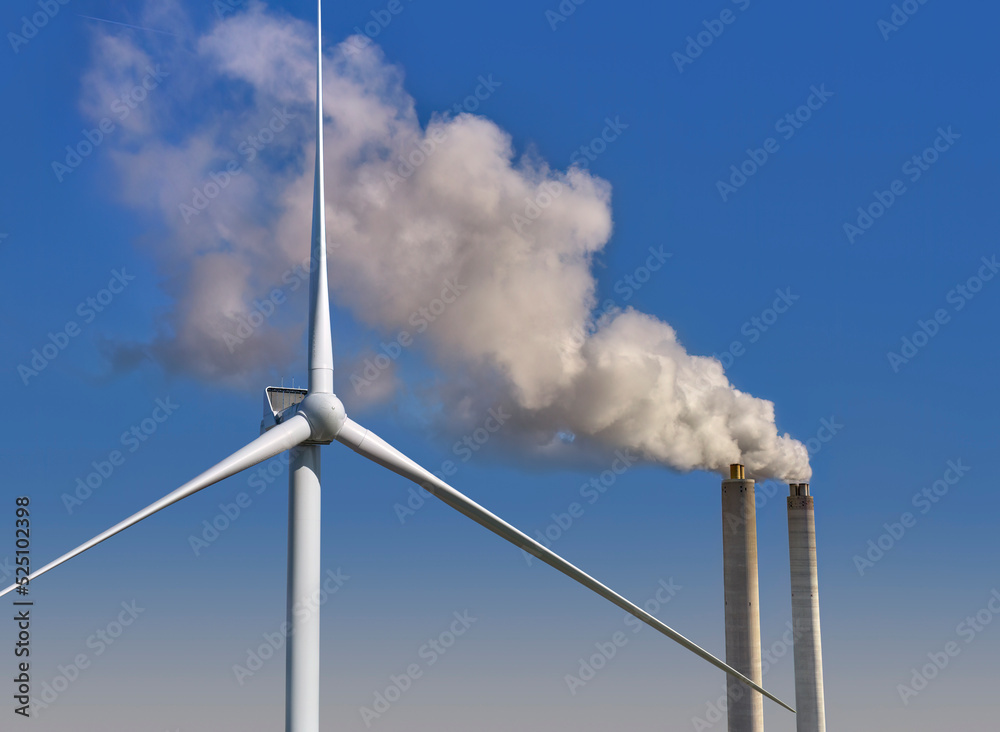 Clean vs dirty energy. Wind turbines against fuel coal power plant