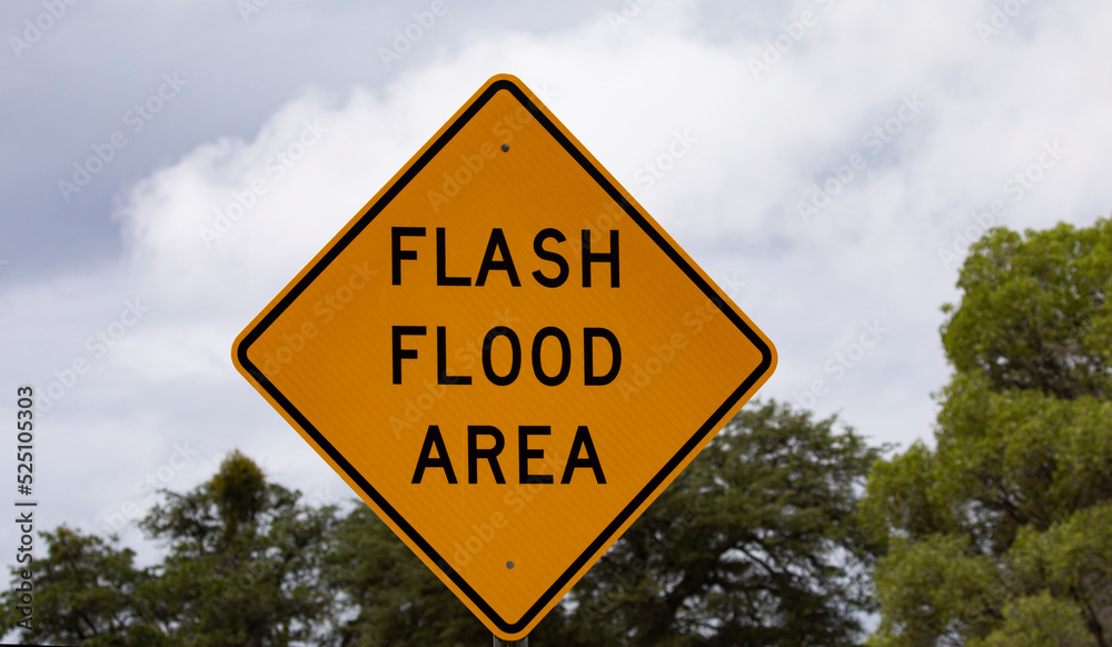 FLASH FLOOD AREA warning sign of flooding threat FLASH FLOOD AREA warning sign of flooding threat
