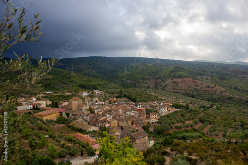 Wind farm, with the mountains in the background and a small inland Mediterranean village