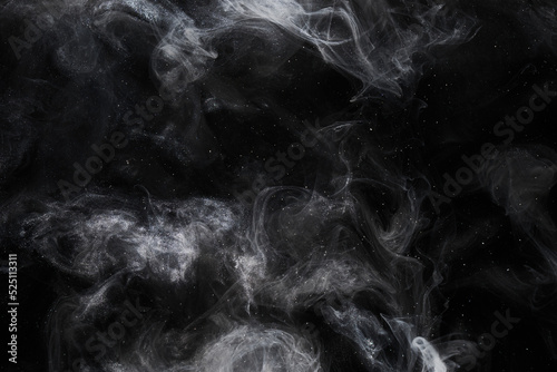 Liquid fluid art abstract background. Black white jets and smoke dancing acrylic paints underwater, space ocean, universe explosion