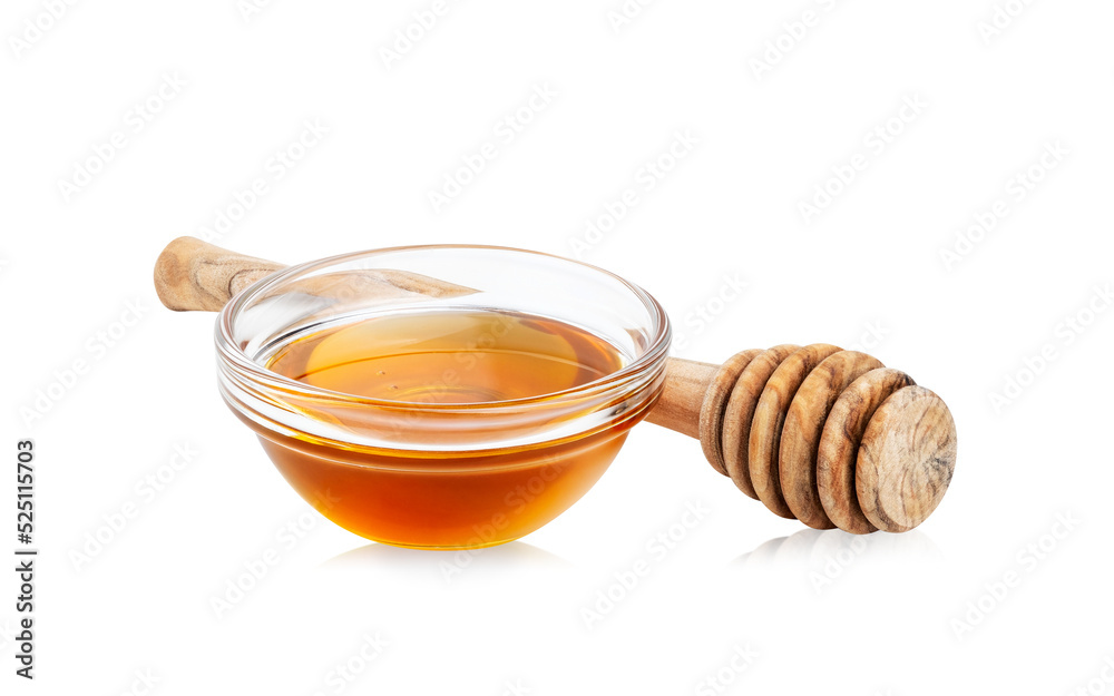 Glass bowl with honey and wood honey dipper isolated on white background. Clipping path Glass bowl with honey and wood honey dipper isolated on white background. Clipping path