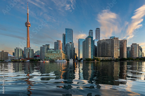 Toronto s downtown skyline seen from the Inner Harbour early on a summer morning. Room for text. 