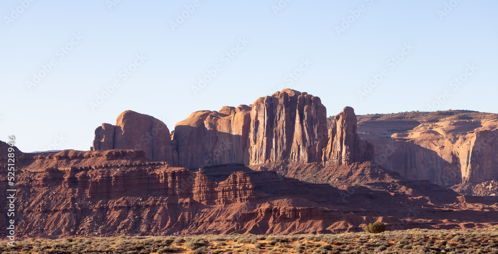 Fototapeta premium Desert Rocky Mountain American Landscape. Morning Sunny Sunrise Sky. Oljato-Monument Valley, Utah, United States. Nature Background