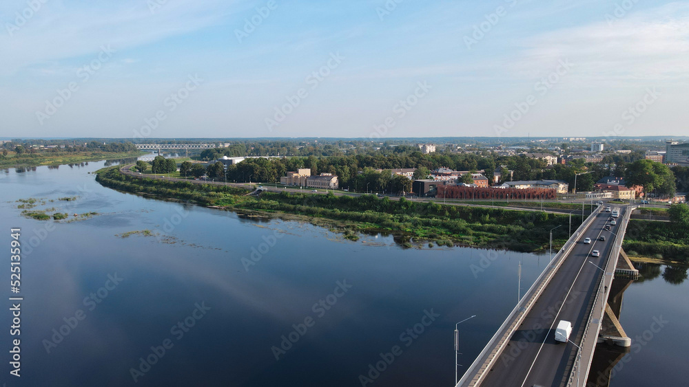 View of the Daugavpils city on river Daugava  and the bridge in summer