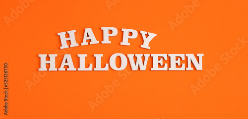 Word Halloween in white letters on orange background