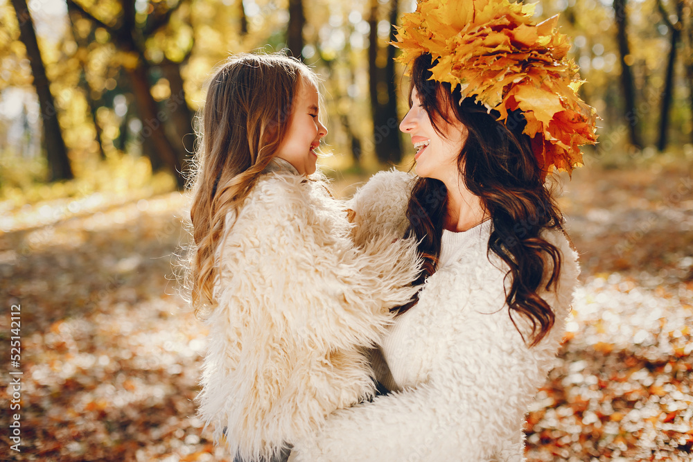 Cute and stylish family in a autumn park Cute and stylish family in a autumn park