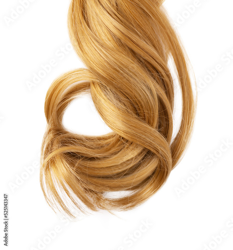 Long golden blond curly hair isolated on white background. A part of blond hair for design.