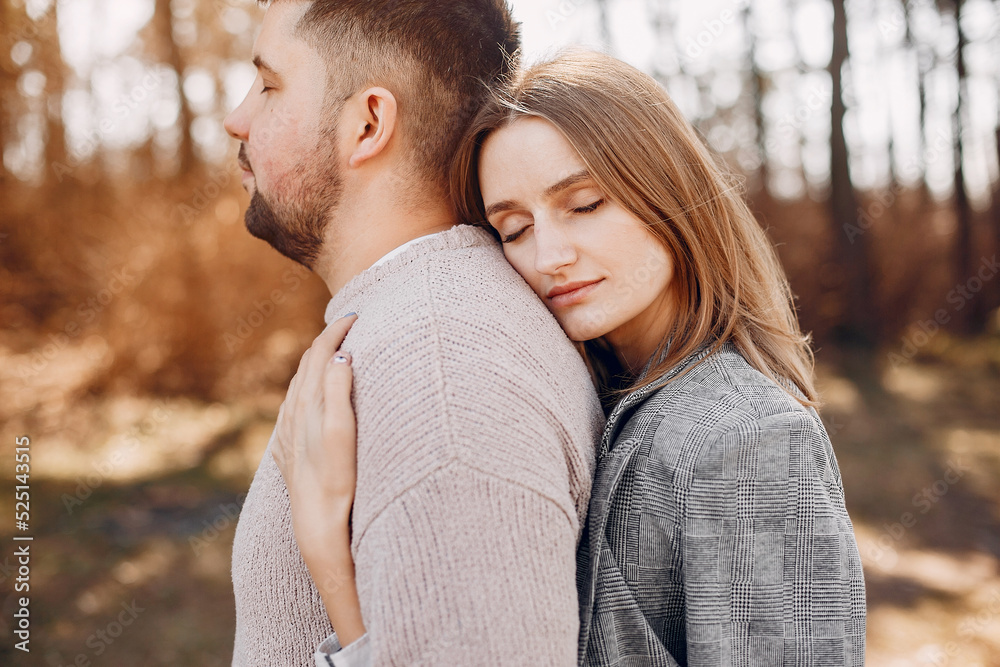 Fototapeta premium Beautiful couple spend time in a summer park