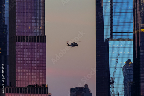 Manhattan skyline Hudson Yards and helicopter on the front, from Weehawken Waterfront in Hudson River at sunset. High quality photo photo