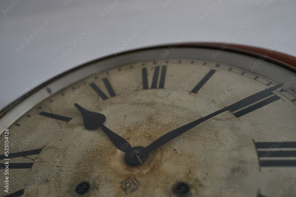 Details of an old clock on white wall Details of an old clock on white wall