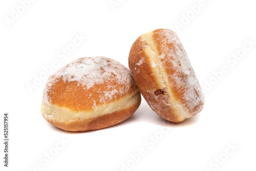 A delicious berliner (berliner donut), isolated on white background. A Berliner is a German donut with no center hole, made of sweet yeast dough fried in fat or oil, with a jam or marmalade filling . photo