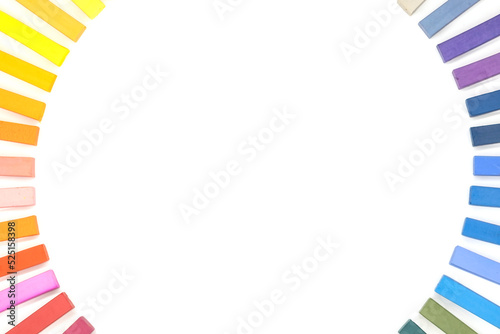 multicolored pastel chalks arranged in a circle