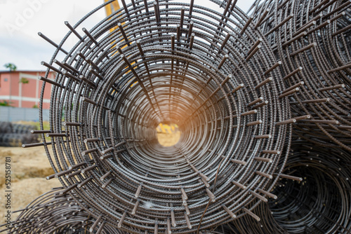 Stainless Steel wire Rolls in construction site. Closeup of Metal Steel reinforcement rod for concrete in store. Wire mesh places on floor ground. Construction site Concept. photo