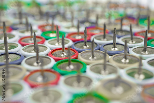 close up of push pins on blurred background and multi color © szymon13856