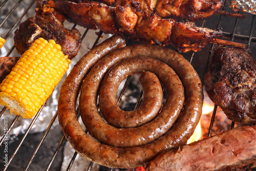 South African braai. Braai including boerewors sausage, lamb chops and chicken kebabs. Including mielie or corn on the cob