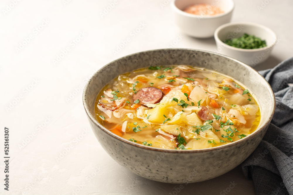 Polish sauerkraut soup Kapusniak in bowl on concrete background Polish sauerkraut soup Kapusniak in bowl on concrete background
