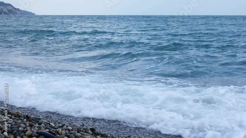 Sea waves beat the shore at the moment of sea excitement