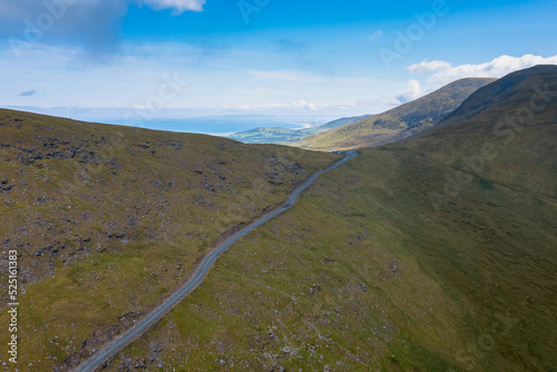 landscape with the steep mountain road leading to the top of Connor Pass on the Dingle Peninsula