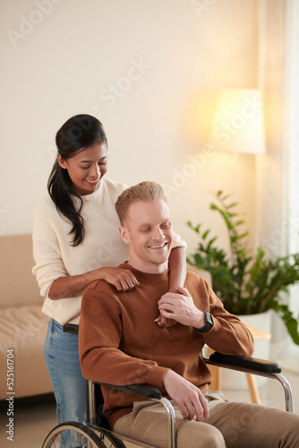 Woman Hugging Boyfriend in Wheelchair